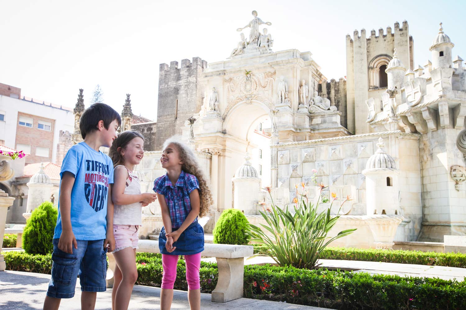 Three smiling children at Portugal dos Pequenitos 