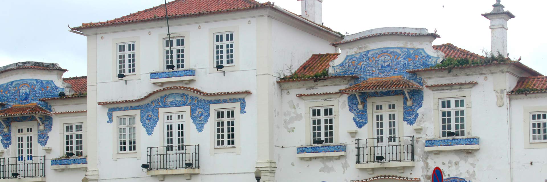 The old Aveiro train station, decorated with tiles, now a cultural center.