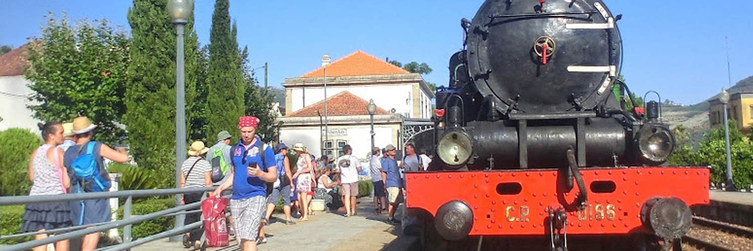 The front of the Douro Historical Train’s locomotive at Pinhão station, with passengers on the platform