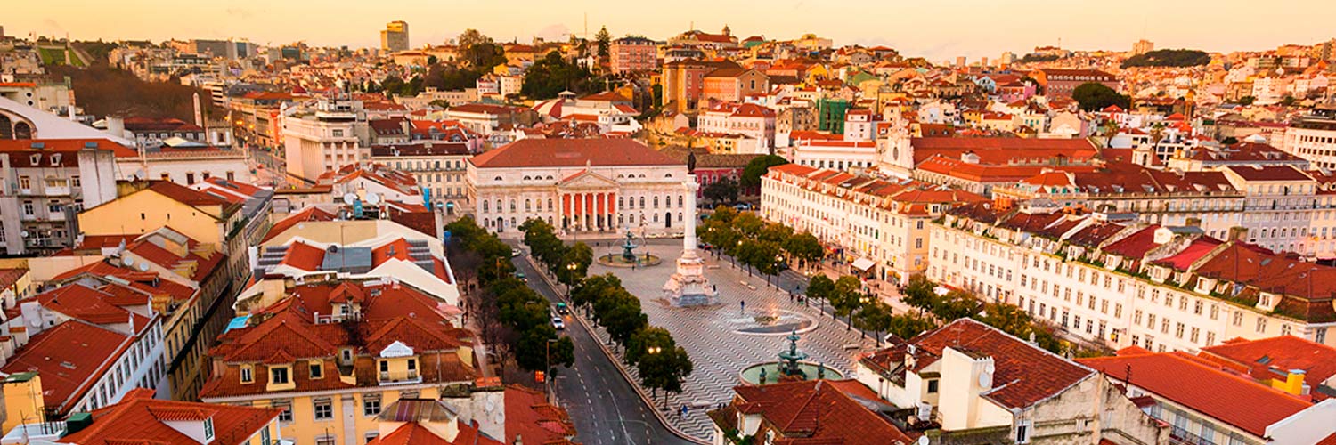 View of Rossio Square and Avenida da Liberdade and buildings on the hills of Lisbon.