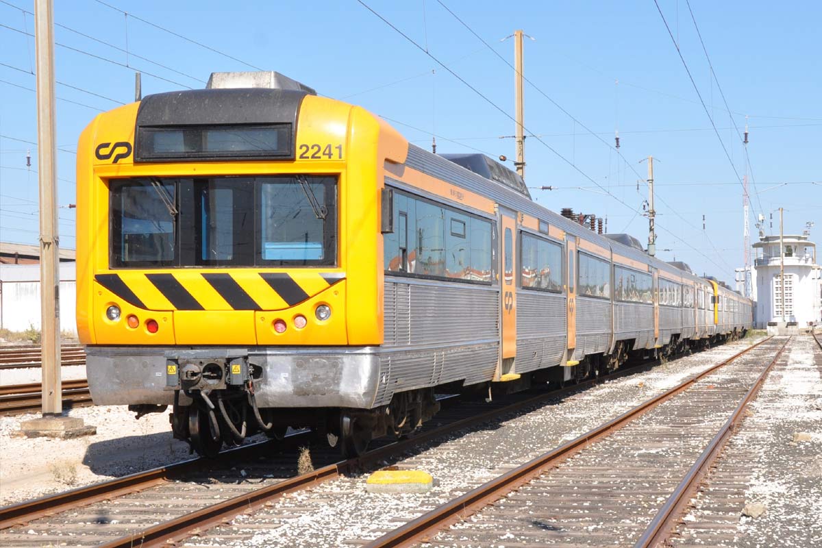 CP 2240 series electric unit with gray and yellow livery, parked on one of the station lines.
