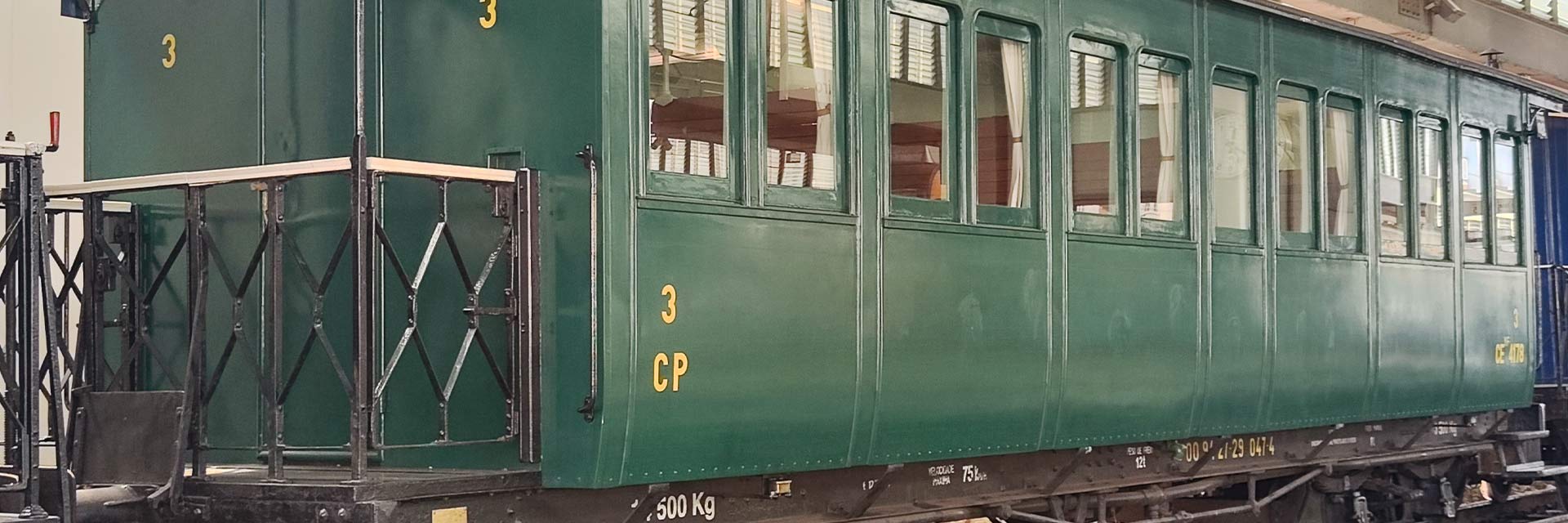 CEyf 4178 narrow gauge passenger coach with green livery stopped at the station.
